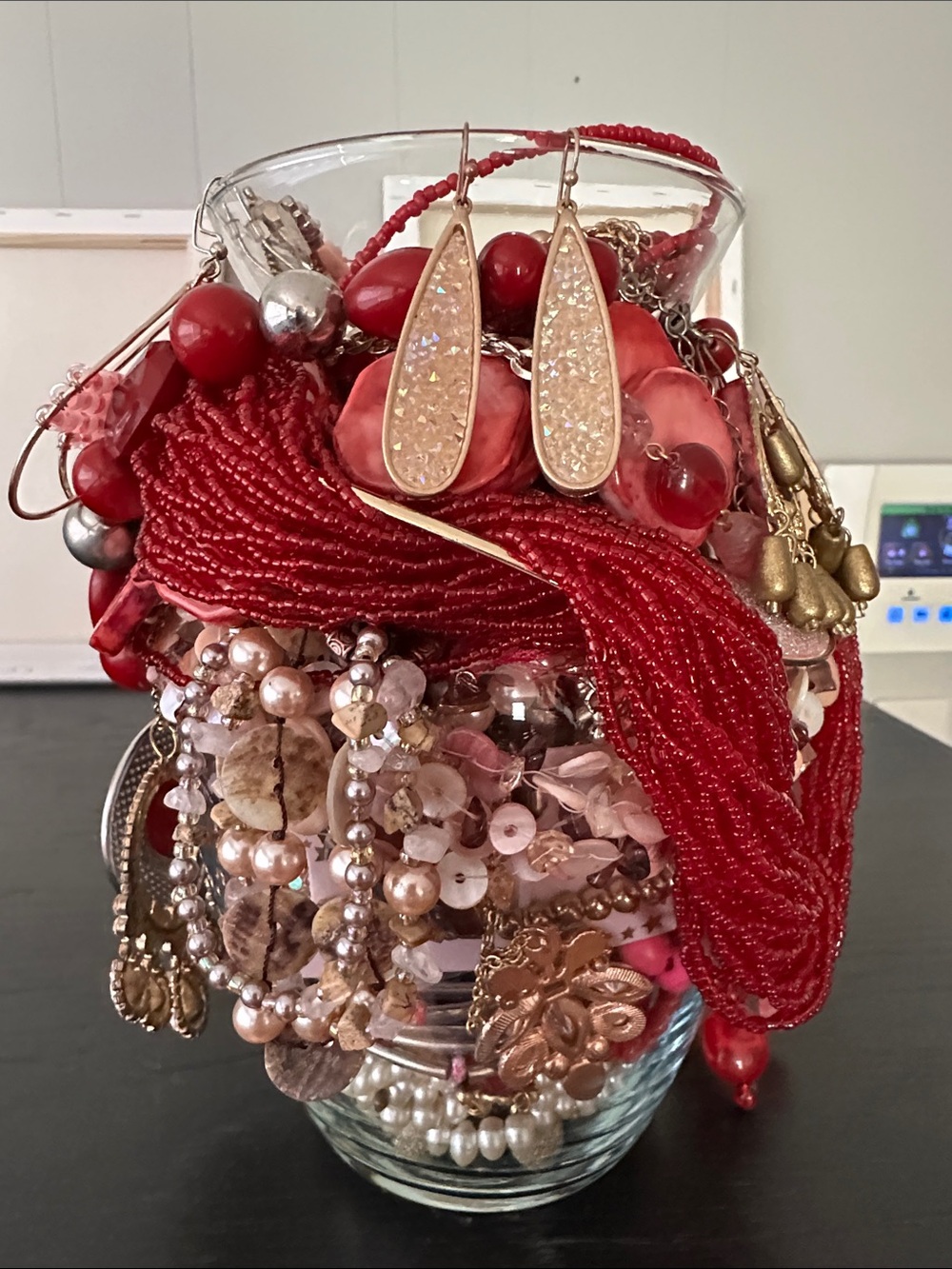 Mystery Jewelry Jar In Bold Statement Pieces In shades of red, pink, and gold.